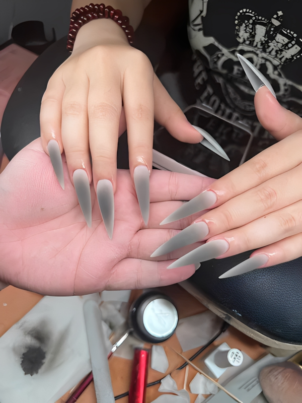Nail artist painting detailed design at Sasxy Nailart